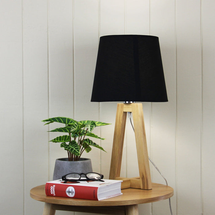 EDRA - Stunning Geometric Scandi Table Lamp Featuring Natural Timber Cross Over Base & Black Poly Cotton Shade